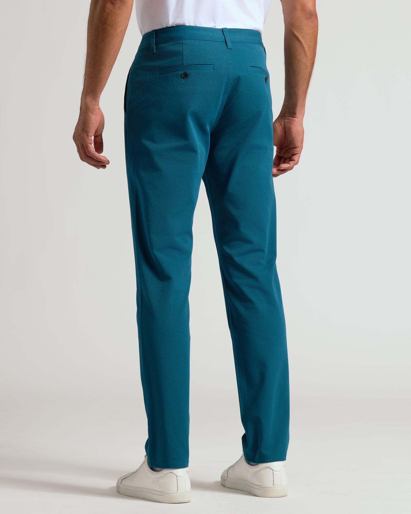 Centurion Slim Twill Chino Pant, teal-blue, back view, paired with sneakers.