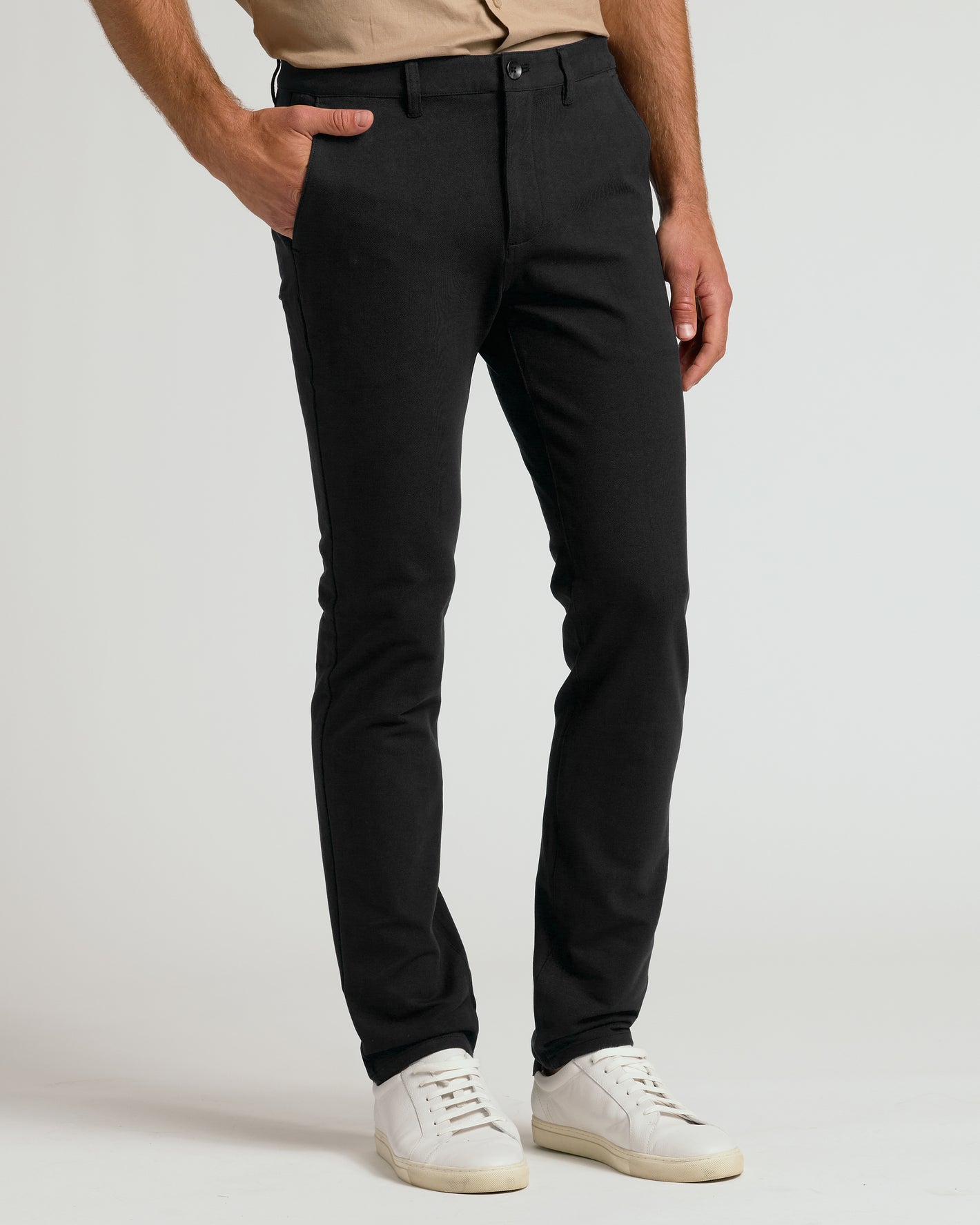 Black & Khaki Slim Chino Pants 2-Pack with white sneakers.
