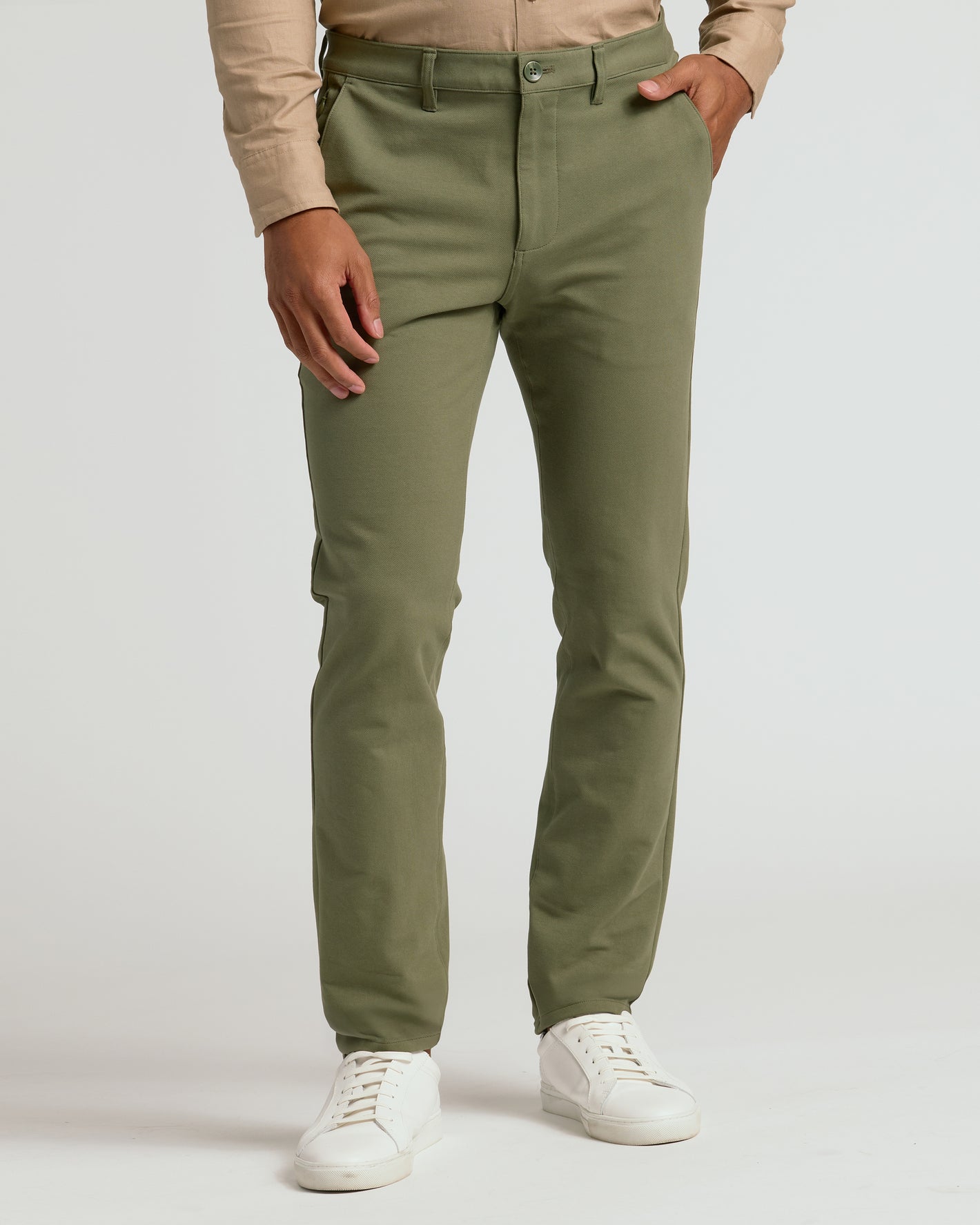 Military Green Slim Chino Pants 2.0 with white sneakers.