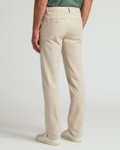 True ClassicSandstone Slim Chino Pants 2.0 with white sneakers.