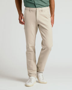 True ClassicSandstone Slim Chino Pants 2.0 with white sneakers.