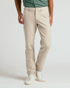 Sandstone Slim Chino Pants 2.0 with white sneakers.