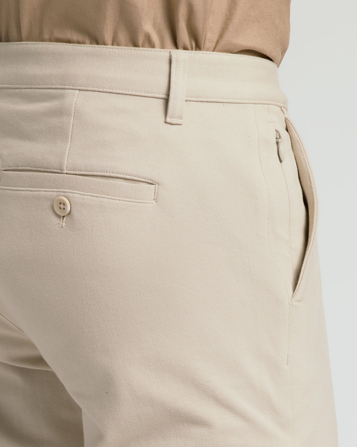 Sandstone Straight Chino Pants 2.0 with hidden zip pocket detail.