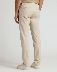 True ClassicSandstone Straight Chino Pants 2.0 with welt back pockets and white sneakers.