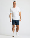 Man wearing Active Comfort Shorts 3-Pack with white T-shirt and sneakers.