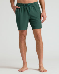 True ClassicModel wearing 7 Marine Spruce Seersucker Swim Trunks with side pockets.