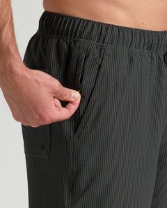 True ClassicMan demonstrates zippered side pocket on 7 Smoke Seersucker Swim Trunks.