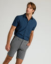 Model wearing 9 Carbon Chino Shorts 2.0 with navy shirt.