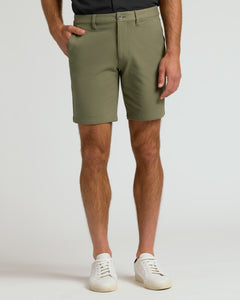 True Classic9 Military Green Chino Shorts 2.0 with white sneakers.