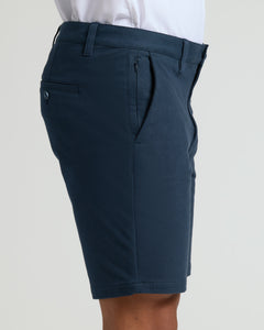 True Classic9 Navy Classic Chino Shorts 2.0 worn with a tucked-in shirt.
