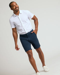 True ClassicMan wearing 9 Navy Classic Chino Shorts 2.0, white shirt, sneakers.
