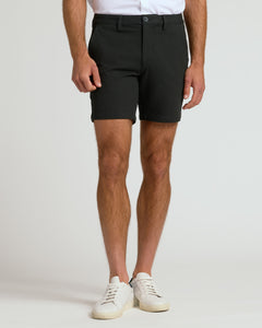 True ClassicModel in fitted 7 Black Chino Shorts with white sneakers.