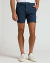 The Standard 7 Chino Shorts 3-Pack on model with white sneakers.
