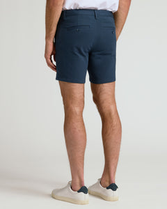True Classic7 Navy Chino Shorts 2.0, fitted, mid-thigh, with buttoned back pockets.