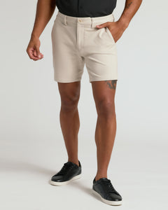 True Classic7 Sandstone Chino Shorts 2.0 with side pockets and black sneakers.