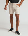 7 Sandstone Chino Shorts 2.0 with side pockets and black sneakers.