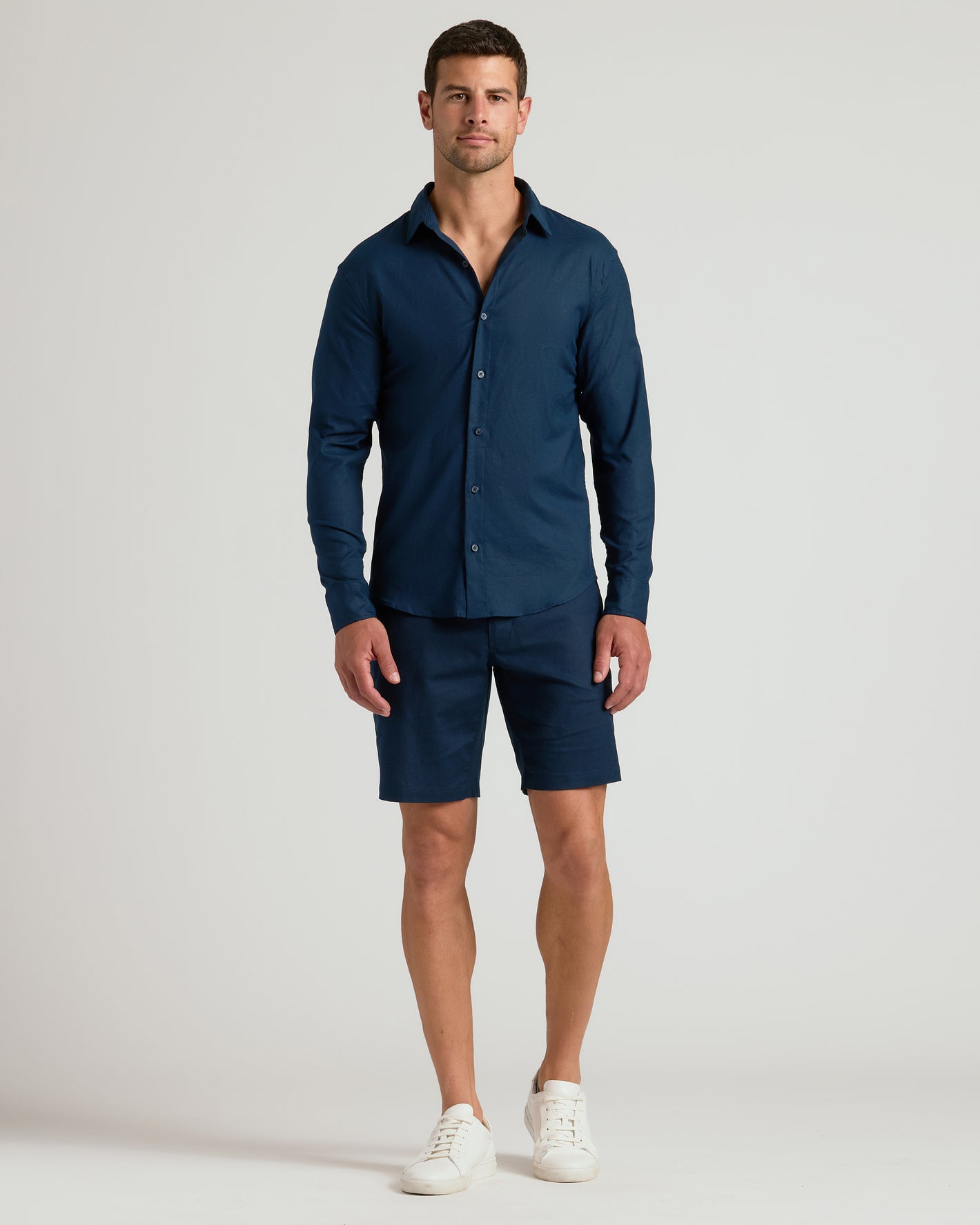 9 Navy Linen Shorts on a male model, styled with white sneakers.