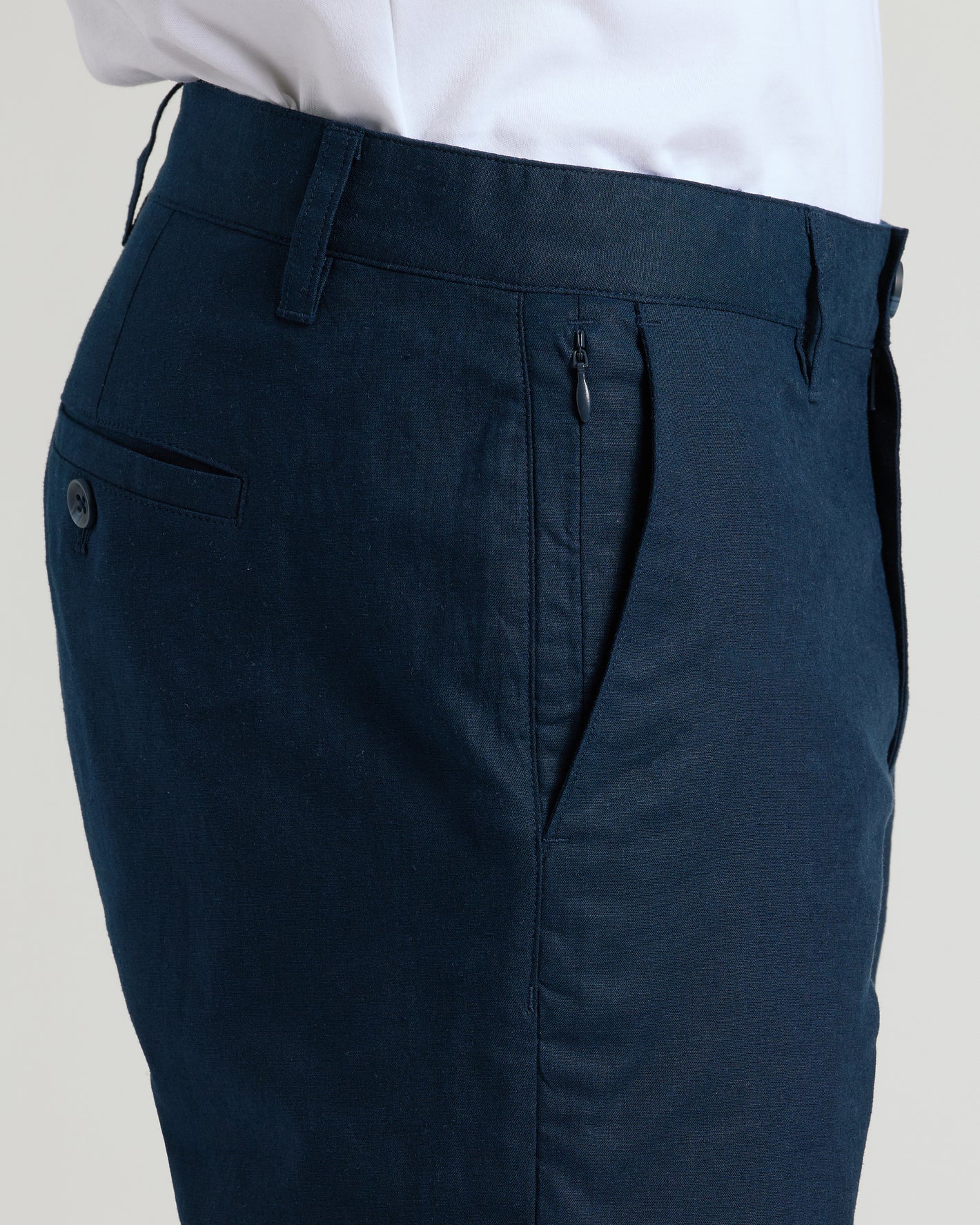 9 Navy Linen Shorts with belt loops, zippered side pocket, button-tab back pocket.