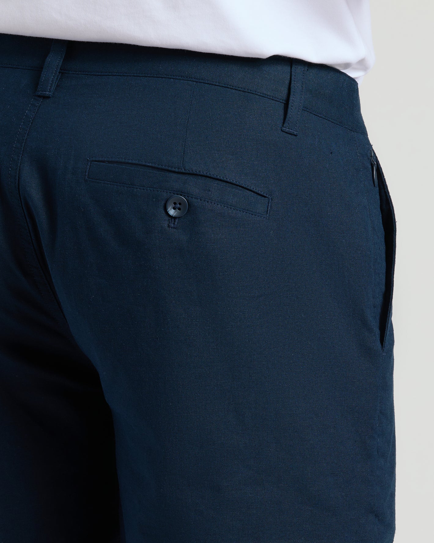 9 Navy Linen Shorts with belt loops, zippered side pocket, buttoned back pocket.