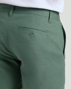 True Classic7 Moss Linen Shorts, rear view with buttoned back welt pocket.
