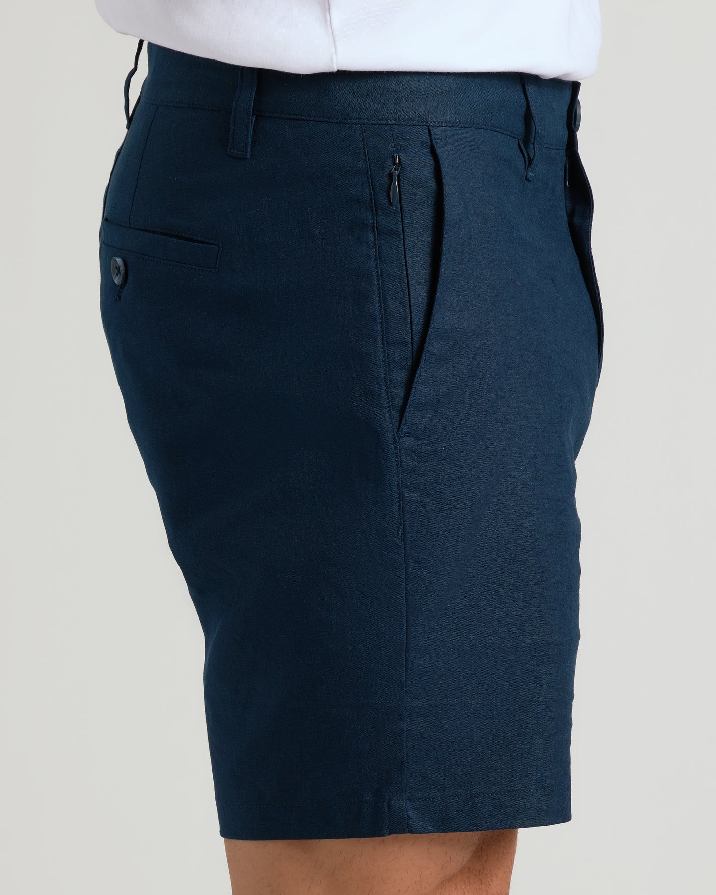 7 Navy Linen Shorts with zippered side pocket and buttoned back pocket.