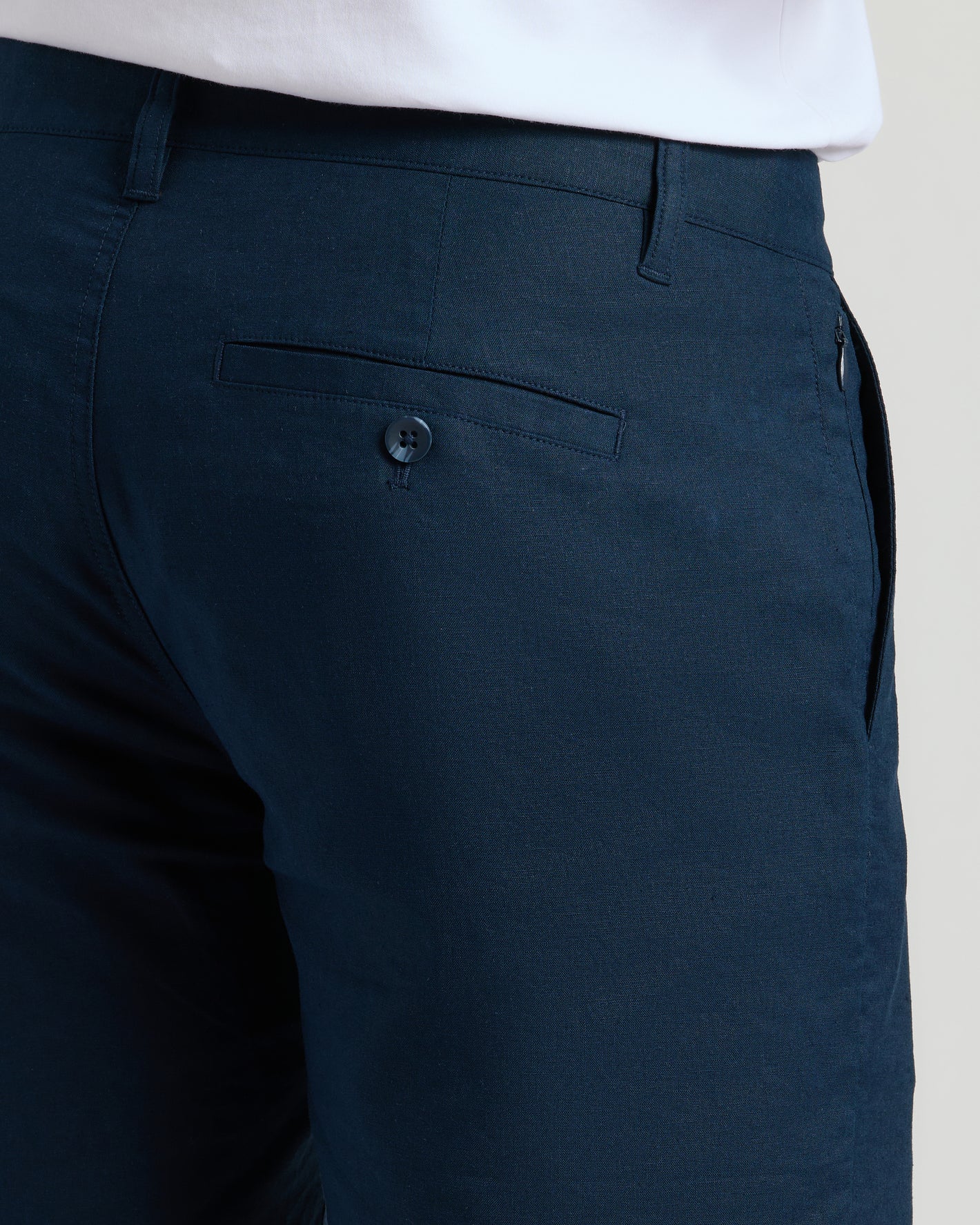 7 Navy Linen Shorts with back welt pocket and side zipper pocket.