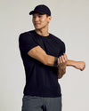 Black Active Running Cap worn by a man stretching his arm.