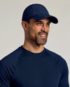 Man wearing Navy Active Running Cap, smiling, showing breathable and functional design.