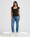 Woman in Women's Black Ribbed U-Neck Tee 3-Pack, fitted and stylish.