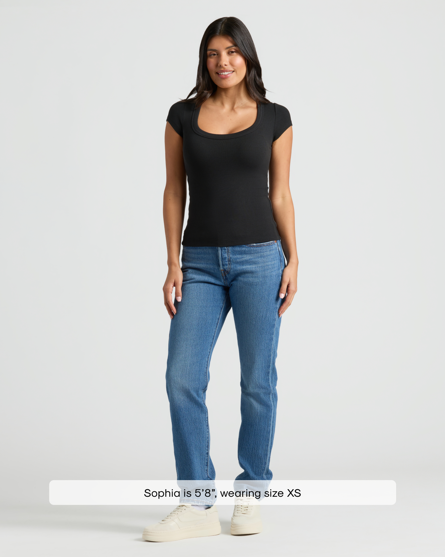 Woman in Women's Black Ribbed U-Neck Tee 3-Pack, fitted and stylish.