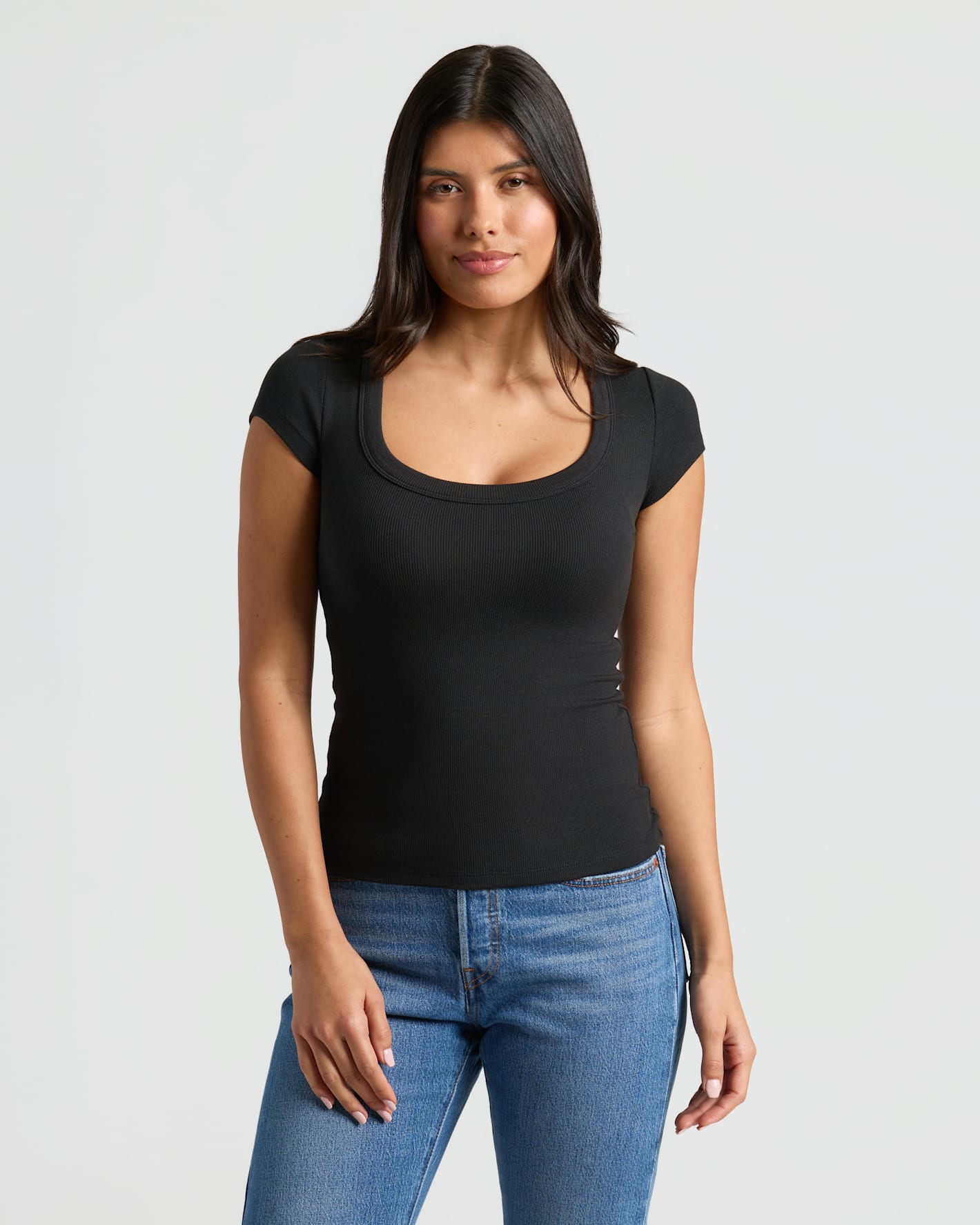 Model wearing Womens Ribbed U-Neck Tee, showcasing its flattering neckline and fit.