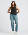 Womens Black Ribbed High Neck Tank worn by smiling woman, casual style.