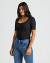 Woman wearing Womens Ribbed 3/4 Sleeve Scoop Neck Tee, black. MODEL_INFO: Sophia is 5'8", wearing a size XS