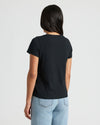Back view of Womens Black Relaxed Slub V-Neck Tee over jeans.