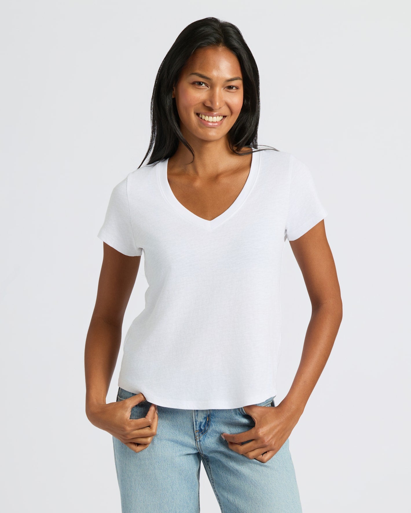 Young adult in a Women's Navy & White Relaxed Slub V-Neck Tee.