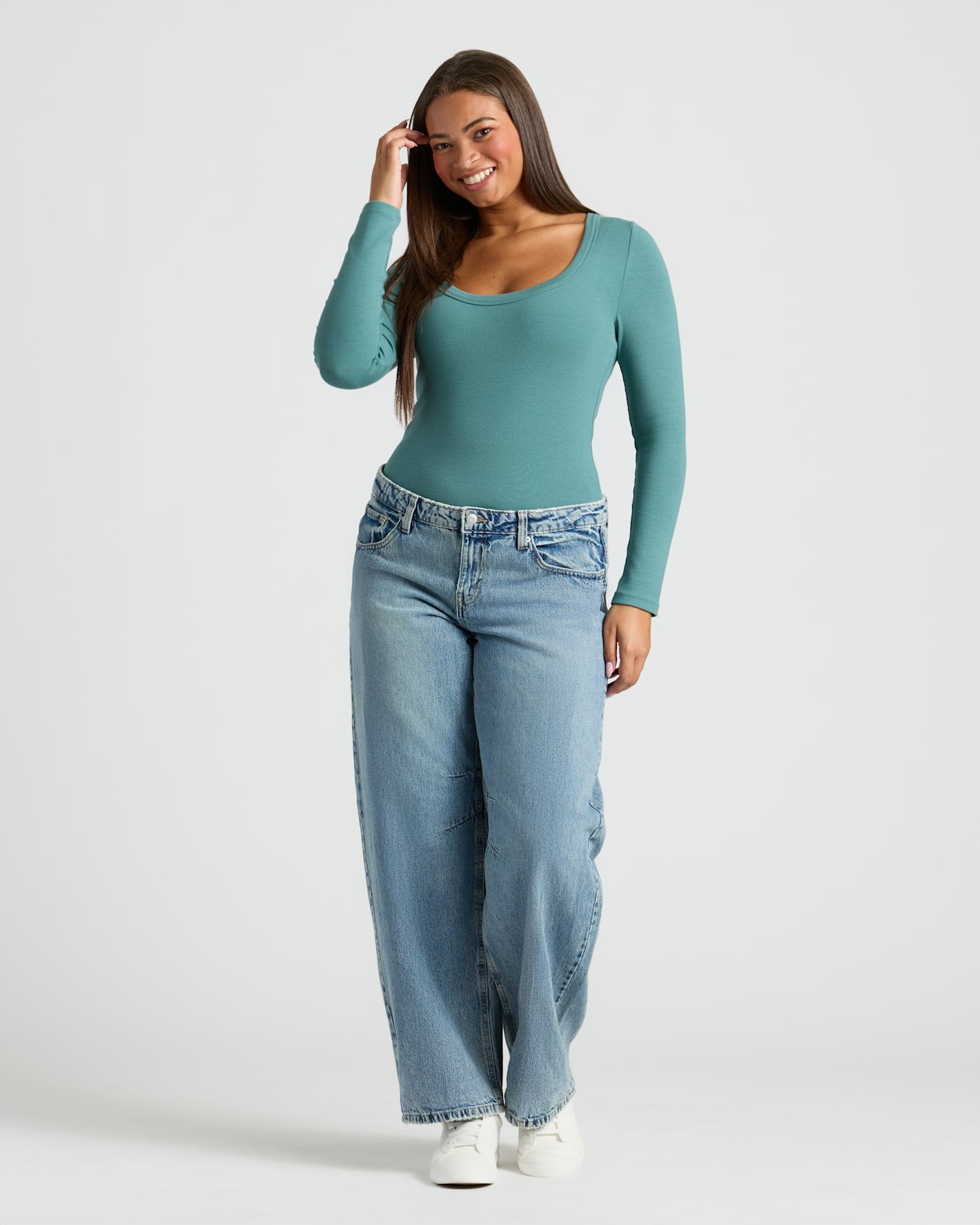 Woman in teal Womens Ribbed Long Sleeve Scoop Neck Tee 6-Pack, jeans, sneakers. MODEL_INFO: Jade is 5'9", wearing a size L