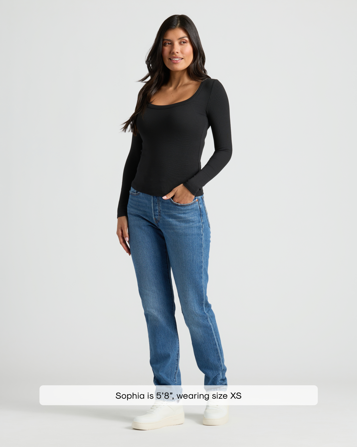 Woman wearing Womens Black Ribbed Long Sleeve Scoop Neck Tee with blue jeans.