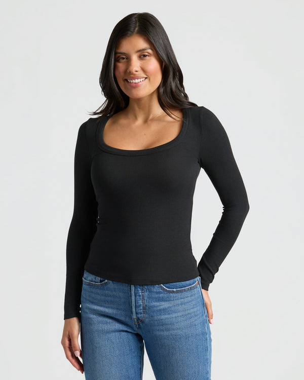 Woman wearing Women's Ribbed Long Sleeve Scoop Neck Tee in black. MODEL_INFO: Sophia is 5'8", wearing a size XS
