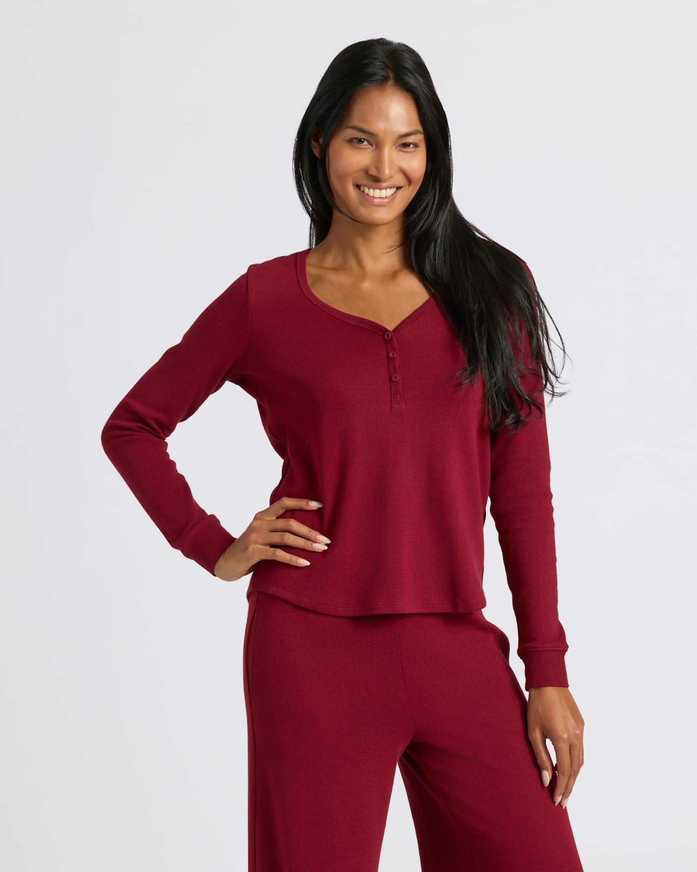 Woman modeling Womens Dark Maroon Waffle Long Sleeve Henley & Waffle Leg Pant.