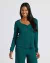 Woman wearing Women's Deep Emerald Waffle Long Sleeve Boxy Henley, smiling.