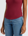 Womens Dark Maroon Ribbed High Neck Tank with light-wash jeans.