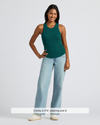 Model in Womens Deep Emerald Ribbed High Neck Tank with jeans.