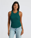Woman in Womens Deep Emerald Ribbed High Neck Tank, smiling.
