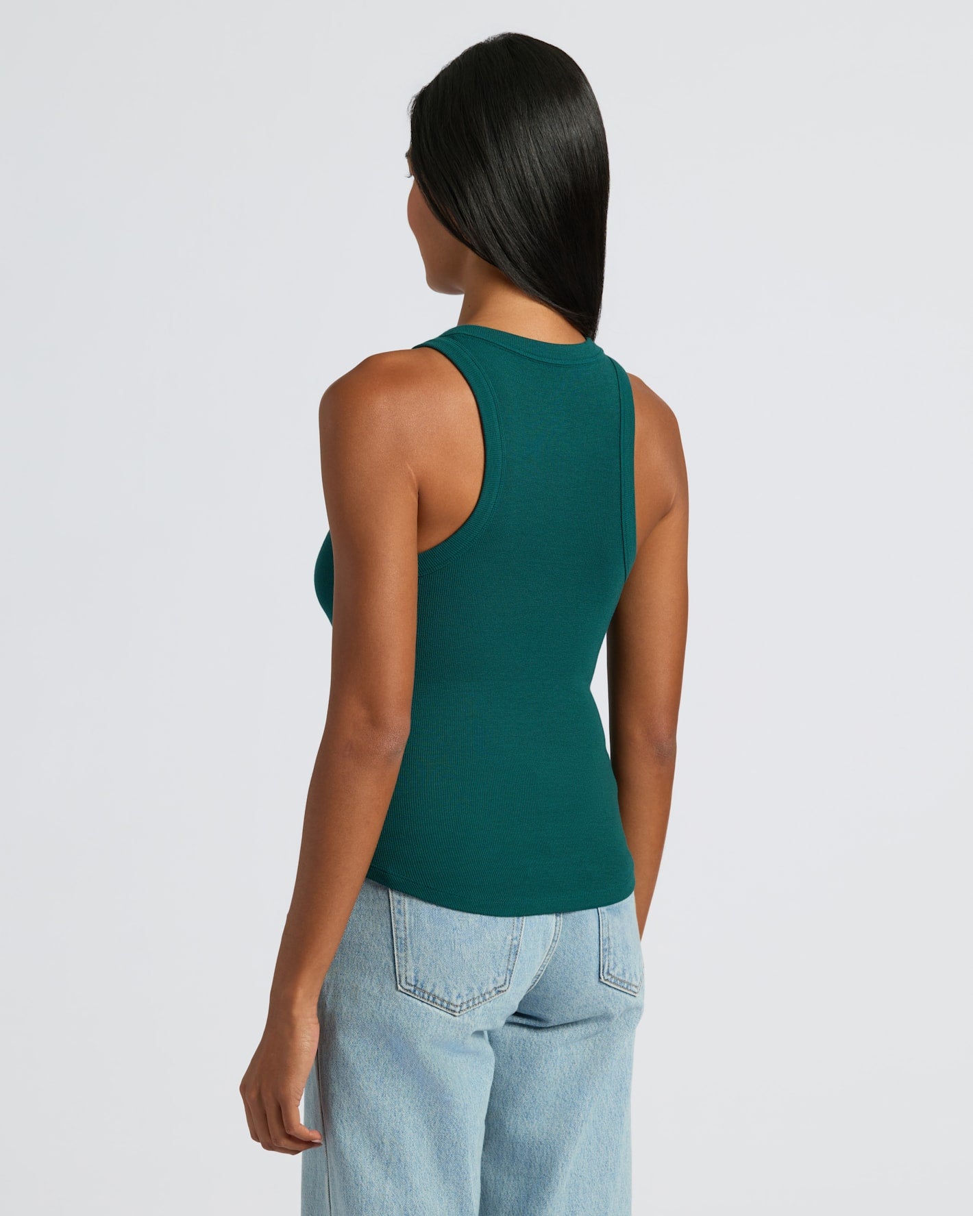 Woman wearing Womens Ribbed High Neck Tank 3-Pack in dark-green.