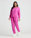 Woman in Womens Electric Fuchsia Slouch Pullover Crew and joggers.