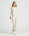 Woman wearing Womens Oatmeal Slouch Pullover Crew and jogger set.