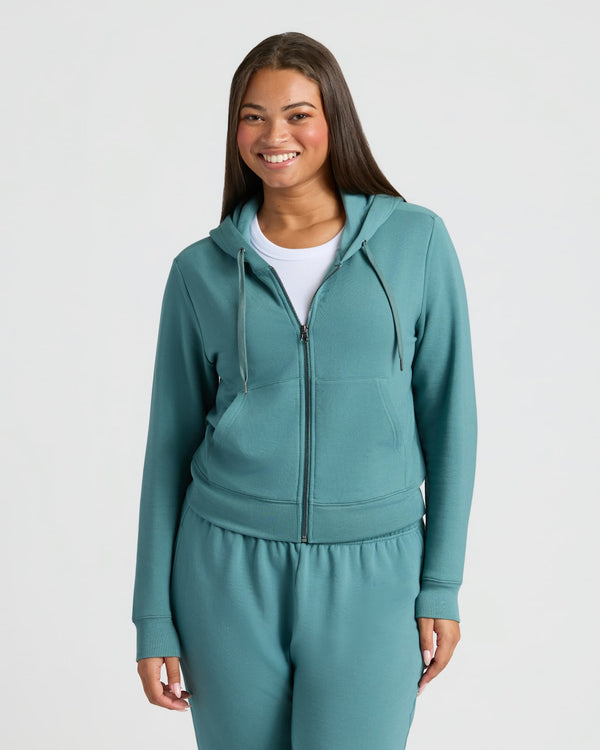 Womens Stormcloud Crop Zip Hoodie & Relaxed Jogger worn by smiling woman.