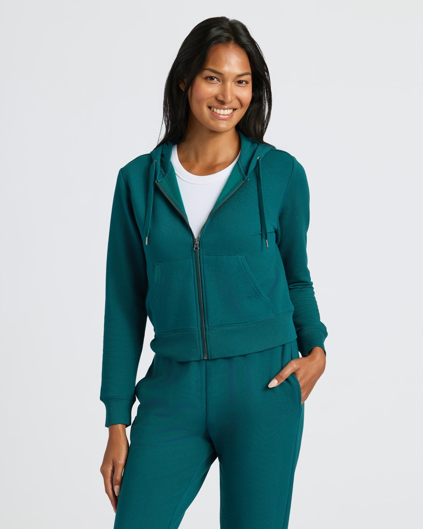 Womens Deep Emerald Crop Zip Hoodie with relaxed, modern fit. MODEL_INFO: Candy is 5'9", wearing a size S