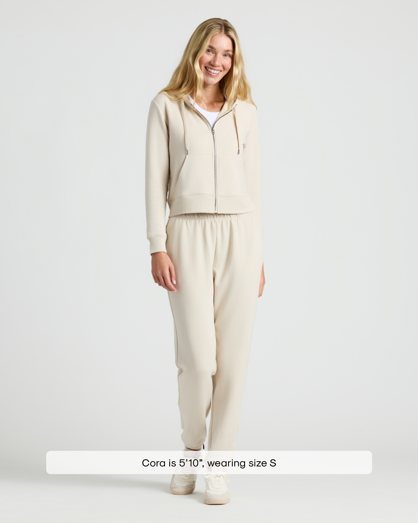 Woman in Womens Oatmeal Crop Zip Hoodie & Relaxed Jogger 2-Pack.