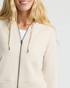 Womens Oatmeal Crop Zip Hoodie worn over a white top.